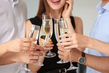 Canvas Print - Young people drinking tasty champagne at party in office