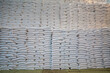 bags of sugar in the warehouse. A wall of sugar sacks in a large warehouse.