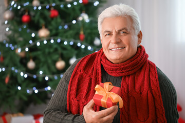 Poster - Mature man celebrating Christmas at home