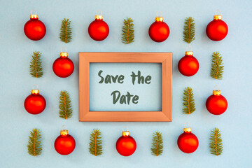 Frame With English Text Save The Date. Christmas Texture With Red Ball And Green Fir Tree Branch. Turquoise Background.