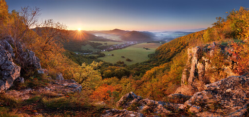 Wall Mural - autumn mountain panorama with golden forest and village in slovakia