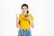 © tuaindeed - Attractive young Asian woman holding mobile smart phone and credit card on white isolated background. Shopping online concept.