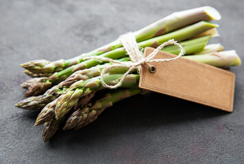 Fresh green asparagus with empty tag