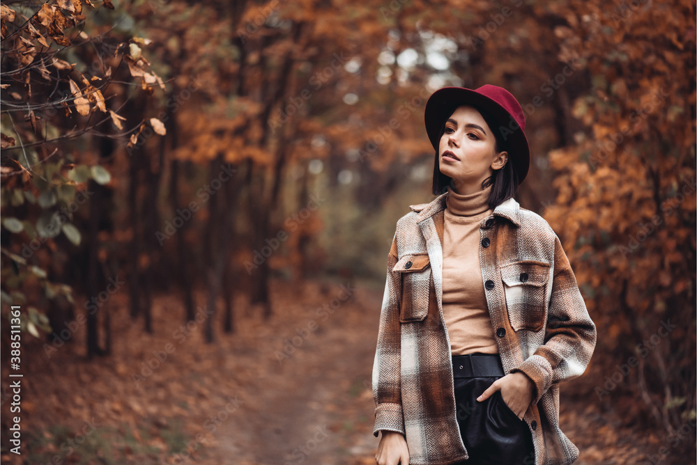 Beautiful woman enjoing autumn day. Beauty and fashion. Autumn fashion and lifestyle. Pretty woman wearing warm autumn clothes, hat and yellow scarf. Autumn mood. Fashionable woman outdoors. - obrazy, fototapety, plakaty 