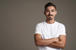 © Drobot Dean - Image of pleased unshaven guy posing on camera with arms crossed