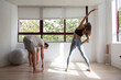 © CarlosGutierrez - One young couple doing exercise at home