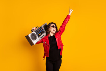 Poster - Photo of funky girl hold boom box sing song raise hand dance isolated over bright shine color background