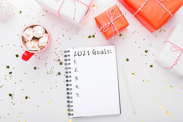 Sticker - 2021 Goals Concept. Notepad with new year resolutions, Christmas presents and hot cocoa