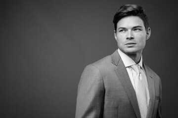 Sticker - Studio shot of young handsome businessman in suit