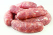 pile of fresh raw pork meat sausage isolated on white background