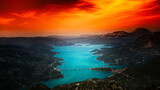 Fototapeta  - sunset in the mountains over a lake