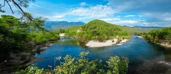 Wall Mural - Koprucay or koprulu river valley with Taurus mountains and rocks, Turkey. Famous by its rafting spots. Stream rapids at the foreground