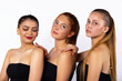 © Viorel - Body care. Three beautiful and attractive girls posing on a white background in the studio. Spa and beauty concept