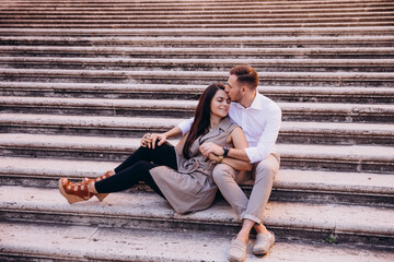 The love story of a guy and a girl on the city streets. Young people travel. Summer walk around the city.