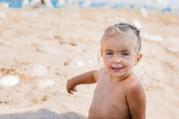 Toddler girl portrait on beach