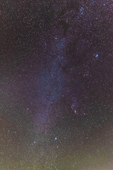 Wall Mural - A beautiful starry night in the mountains on top with beautiful scenery and fog.