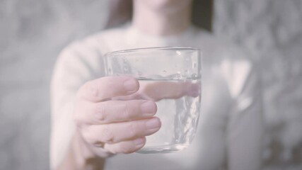 Wall Mural - woman drinking a glass water. Fresh and pure water, drink water is healthy lifestyle. Ecological and healthy drink