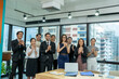 © visoot - Portrait of creative business team standing together in the office,Multiracial business people together at startup.