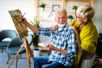 Wall Mural - Handsome senior man and attractive old woman are enjoying spending time together