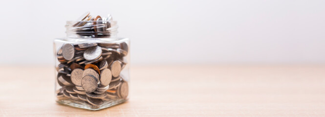 Jar full of coins. Save finance concept. Economy wealth or investment success.