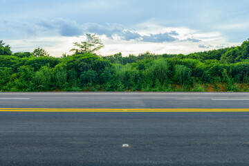 Side view of asphalt road with dark sky background