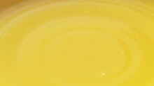 Slow Motion Of Macro Orange Droplet Falling Down Into Fresh Orange Juice Drink
