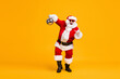 © deagreez - Full body photo crazy santa claus with grey beard hold disco ball show horns symbol dance x-mas christmas party wear sunglass headwear cap isolated bright shine color background