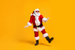 © deagreez - Full size photo of funky santa claus with grey beard listen magic x-mas christmas music headset dance party wear cap headwear sunglass isolated bright shine color background