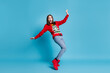 Full length photo of lovely pretty lady stand tiptoes raise hands falling open mouth staring terrified horrified mad look wear red sweater jeans boots isolated blue color background