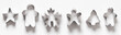 Banner of Christmas-themed cookie cutters for gingerbread in raw on white background. Xmas concept. Top view, flat lay.