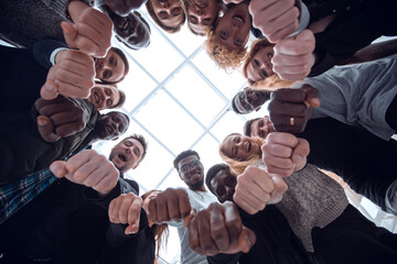 Wall Mural - group of diverse young people joining their hands in a ring