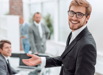 close up. smiling friendly businessman standing in the office