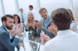 © ASDF - background image business people applauding in the conference room