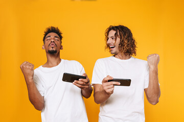 Sticker - Two excited african man friends standing isolated