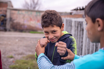 Wall Mural - Portrait of little gypsy boy ready for fight 