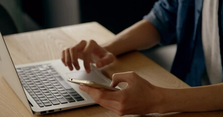 Poster - Mid section of woman using laptop and smartphone