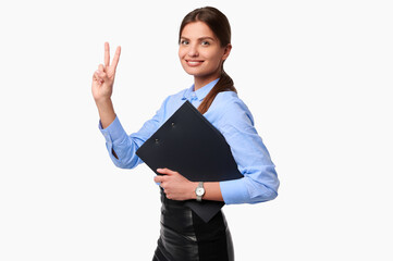 Businesswoman holding folder on white isolate background. Smiling caucasian female worker in uniform showing victory gesture