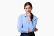 Pensive businesswoman in blue shirt on white isolated background