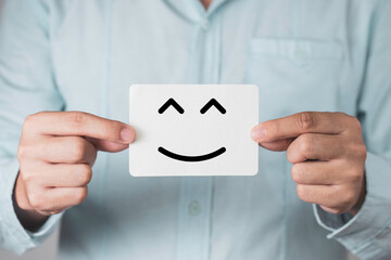 Poster - Businessman holding white paper.and showing smile or happiness face. Customer satisfaction for product and service concept.