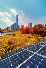 Wall Mural - ecological energy renewable solar panel plant with urban landscape landmarks
