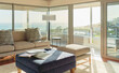 © Trevor Adeline/Caia Image - Sunny home showcase interior living room with ocean view