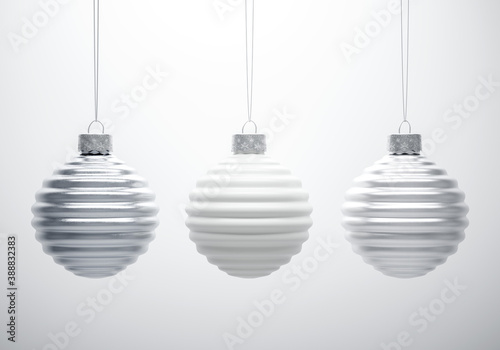 Cuadros en Lienzo Black and white composition of three horizontally ribbed Christmas balls hanging in line