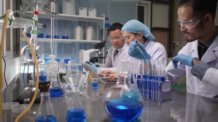 Wall Mural - scientist team has researching in the laboratory, meeting and writing analysis results in the labora
