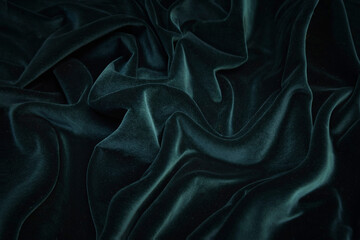 Texture, background, pattern. Texture of green velvet fabric. Beautiful emerald green soft velvet fabric.