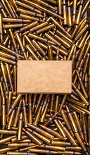 Background From Cartridges For A Carbine. A Box Of Cartridges. Ammunition For Modern Weapons