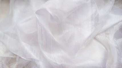 Photo of white silk draped. View from above. Abstract background. 