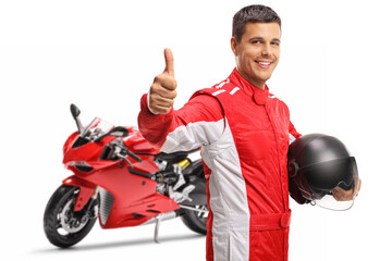 Canvas Print - Motorbike racer holding a helmet and showing thumbs up