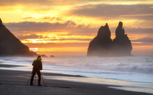 Landscape Photographer, Looked On Trolls Fingers In Atlantic Ocean During Sunrise.