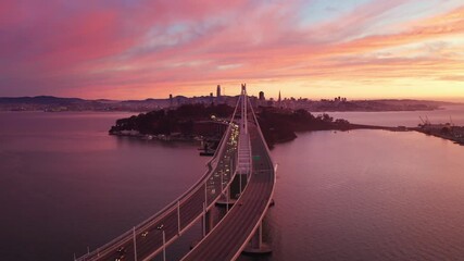 Canvas Print - San Francisco Oakland Bay Bridge Aerial Cityscape Flythrough with Colorful Sunset