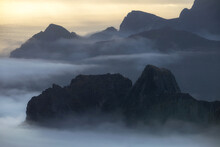 Misty Mountains In The Fog At Sunset